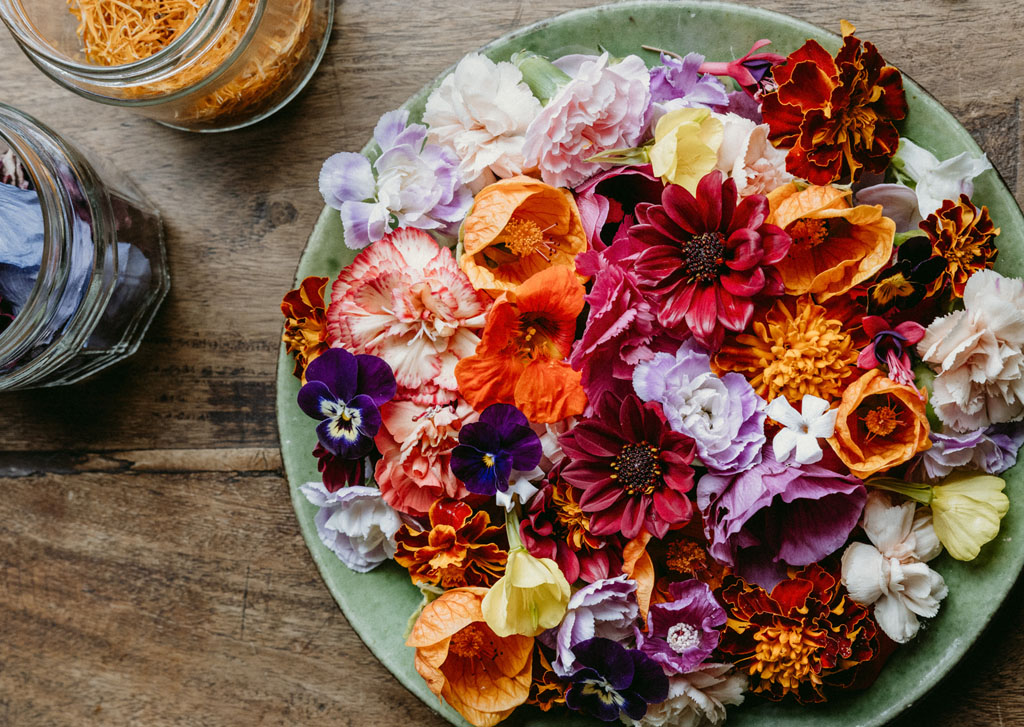 Lifestyle shot of flowers and petals on a plate, from A Floral Feast by Carolyn Dunster